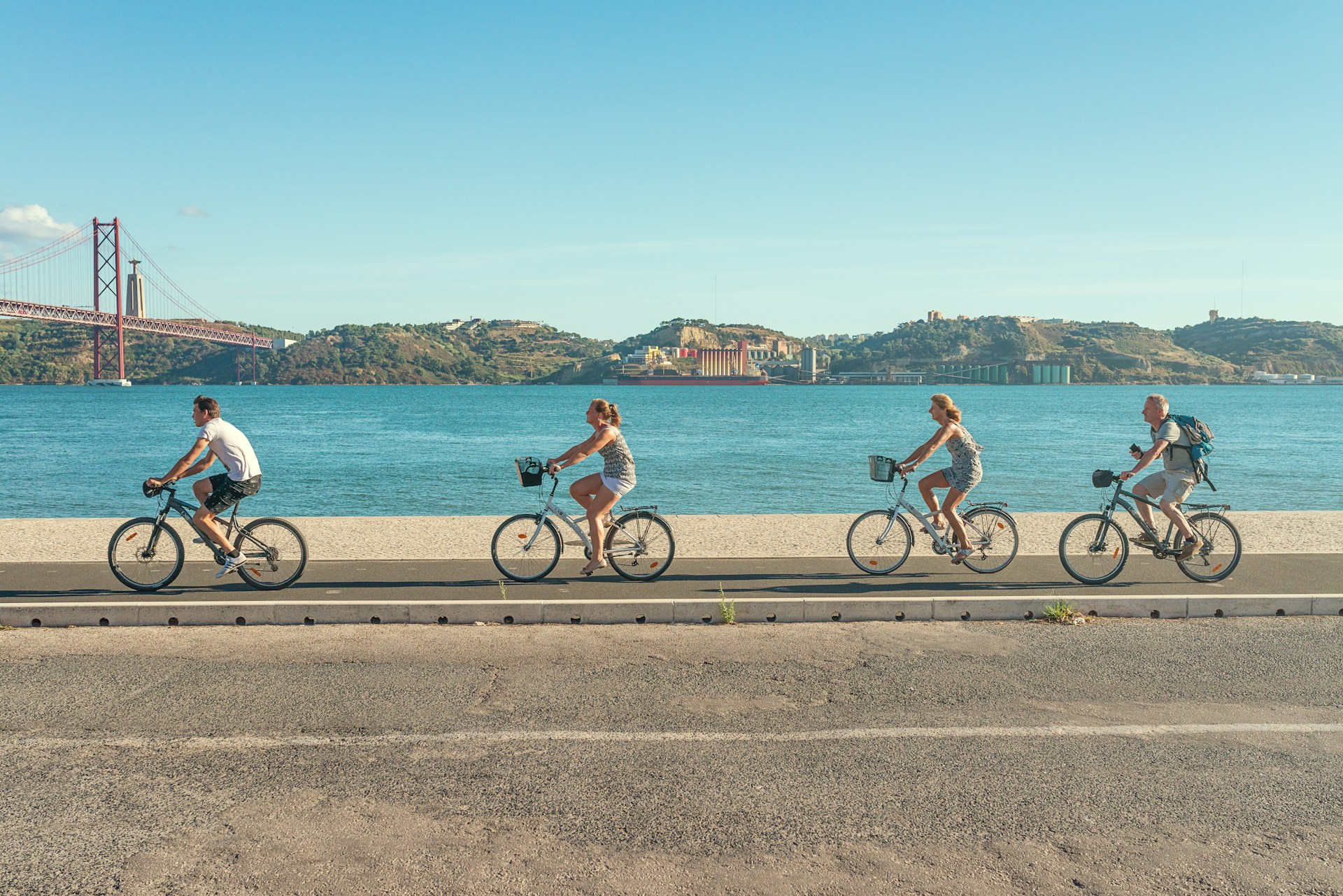Cyclists riding along the River Tagus